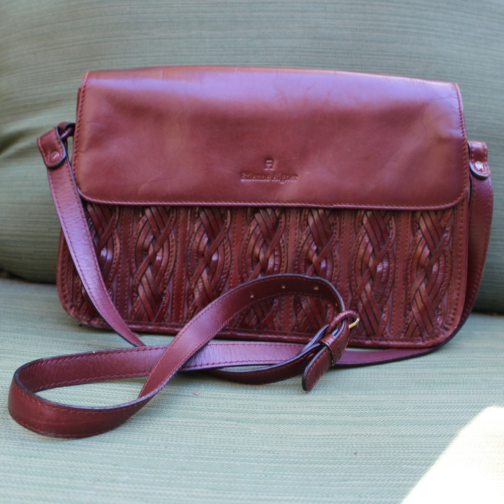 Etienne Aigner  Crossbody w/ front flap
Braided detail on flap.